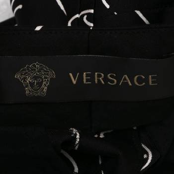 бирка Брюки Versace