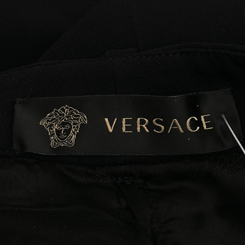 бирка Брюки Versace