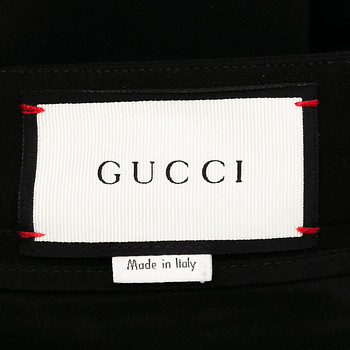 бирка Брюки Gucci