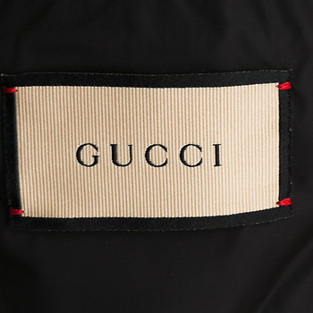 бирка Пуховик Gucci