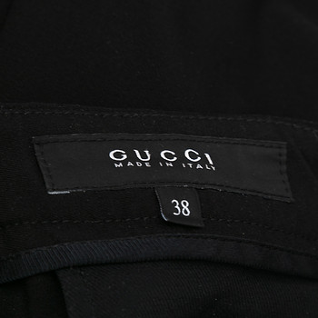 бирка Брюки Gucci