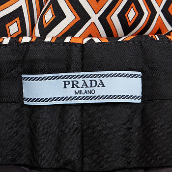 бирка Брюки Prada