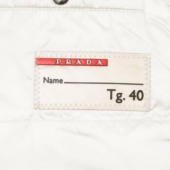 бирка Пуховик Prada