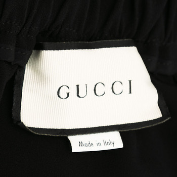 бирка Брюки Gucci