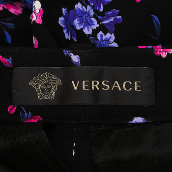 бирка Брюки Versace