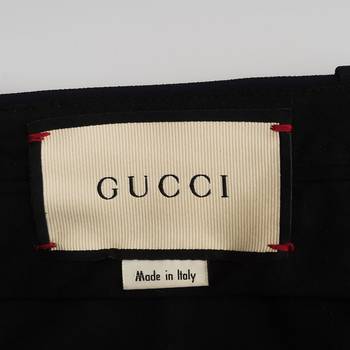 бирка Брюки Gucci