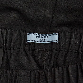 бирка Брюки Prada