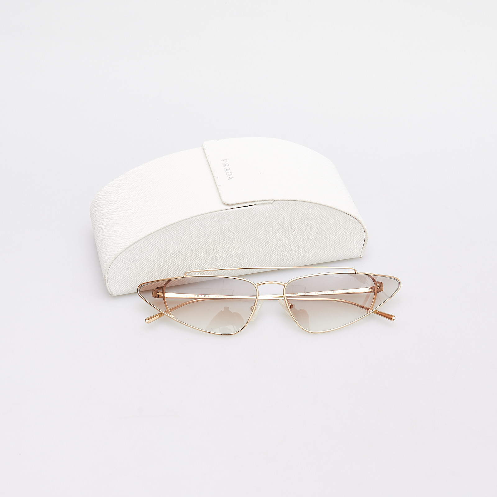 Очки золотого цвета Prada - фото из каталога магазина брендовой одежды Second Friend Store Очки Prada - купить оригинал в секонд-хенде SFS - 2