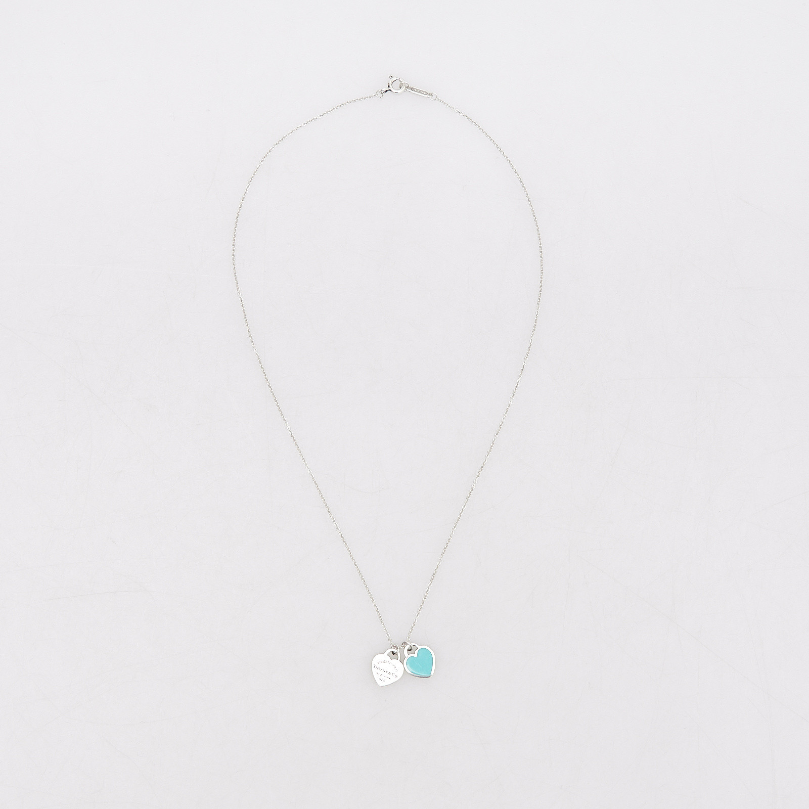 Подвеска серебряного цвета Tiffany&Co - фото из каталога магазина брендовой одежды Second Friend Store Подвеска Tiffany&Co - купить оригинал в секонд-хенде SFS - 1